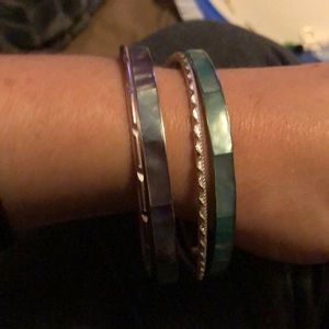 A few different shades of blue bracelets and silver ones.